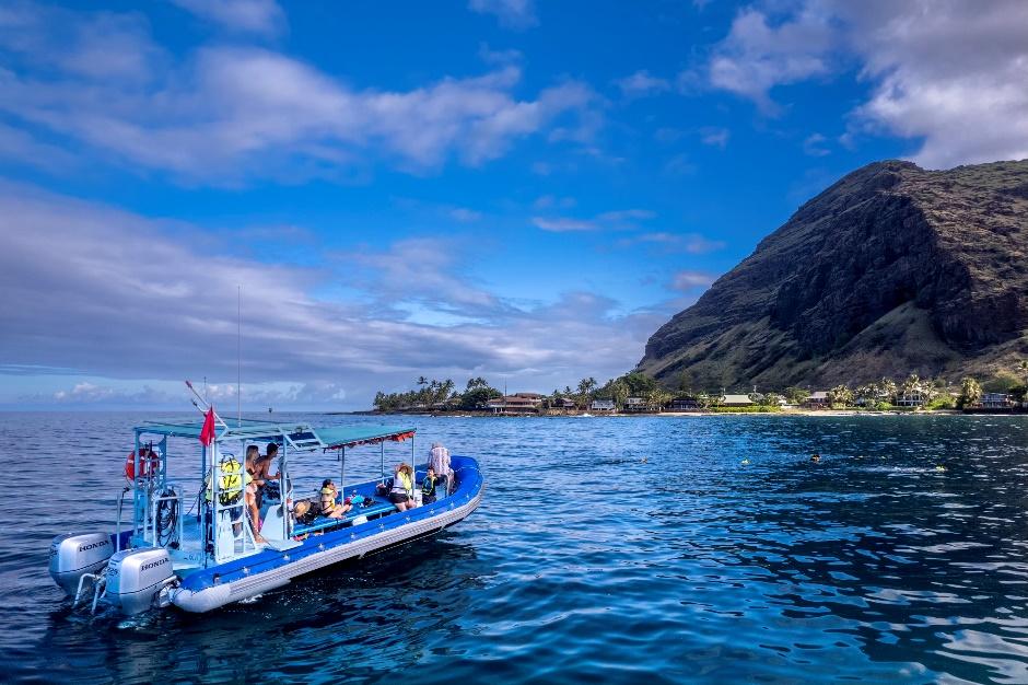 a small boat in a large body of water